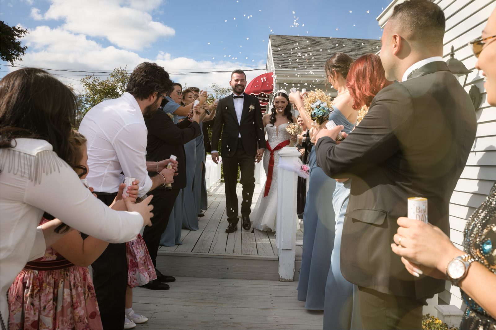 Couple walking through a confetti exit