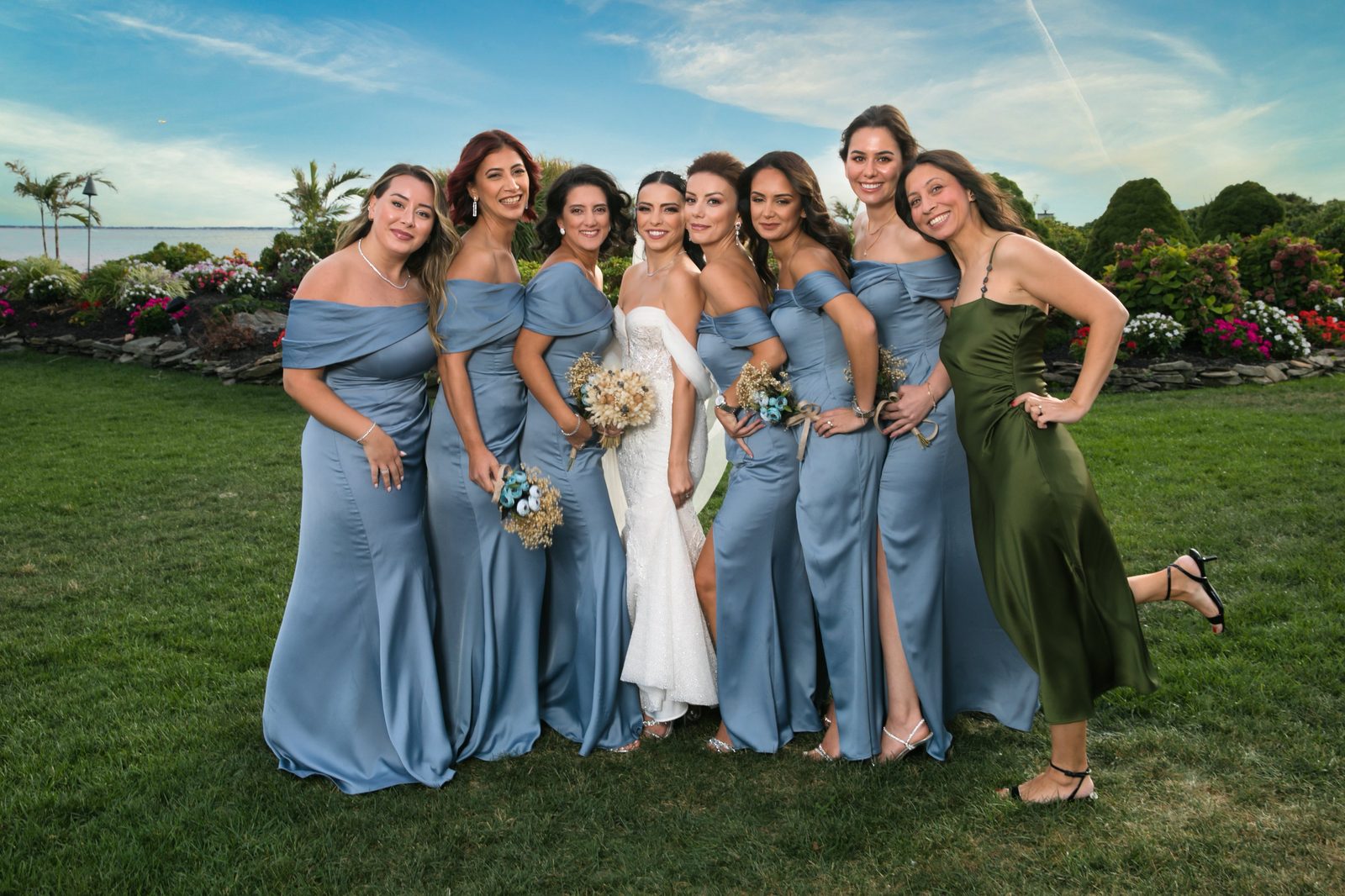 Bride with bridesmaids by the water