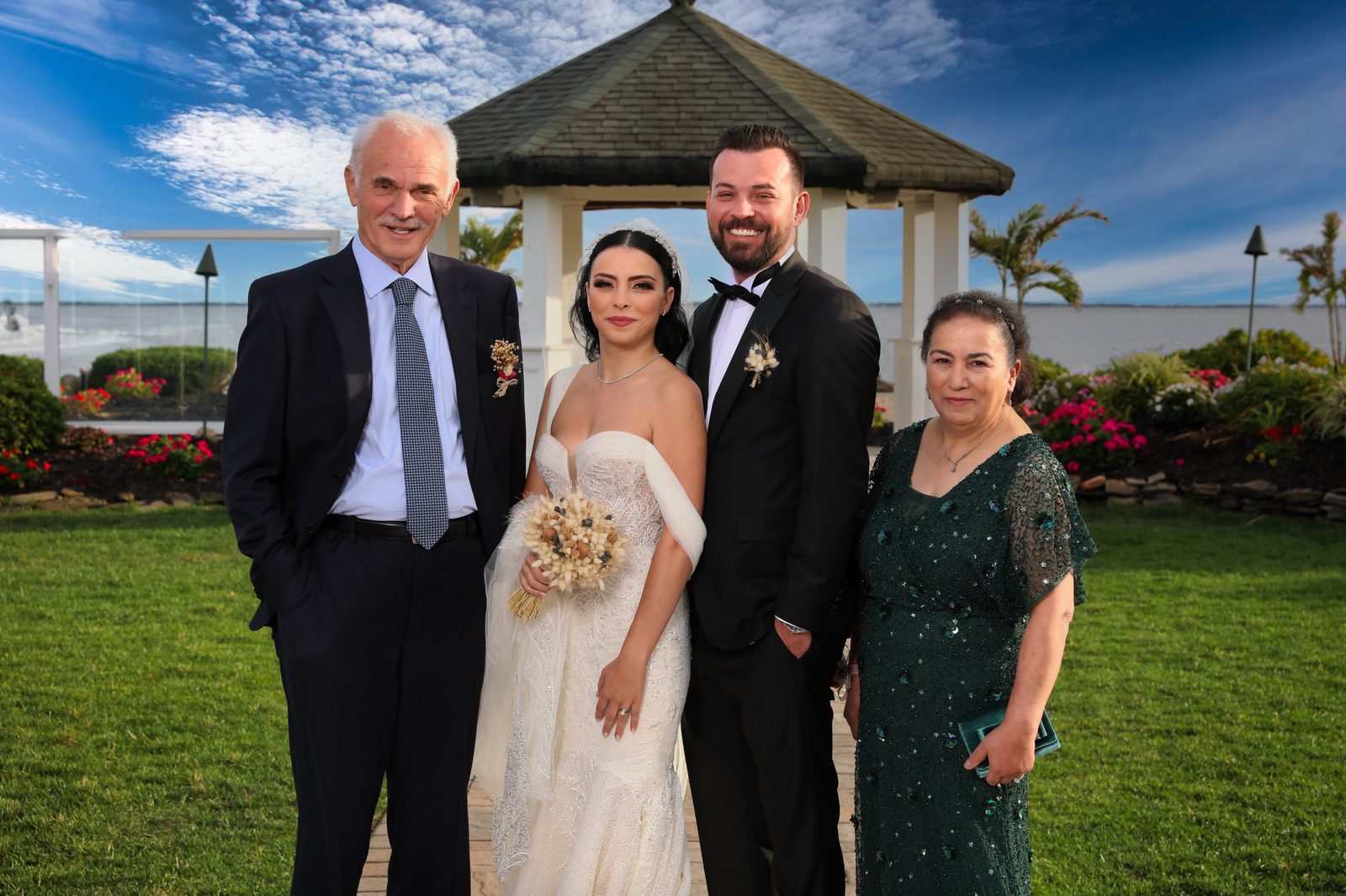 Couple with family by the gazebo